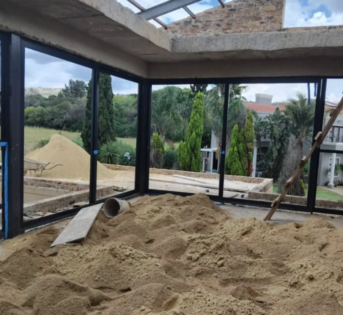 KSR Group installer fitting an aluminium door frame on site in Gauteng