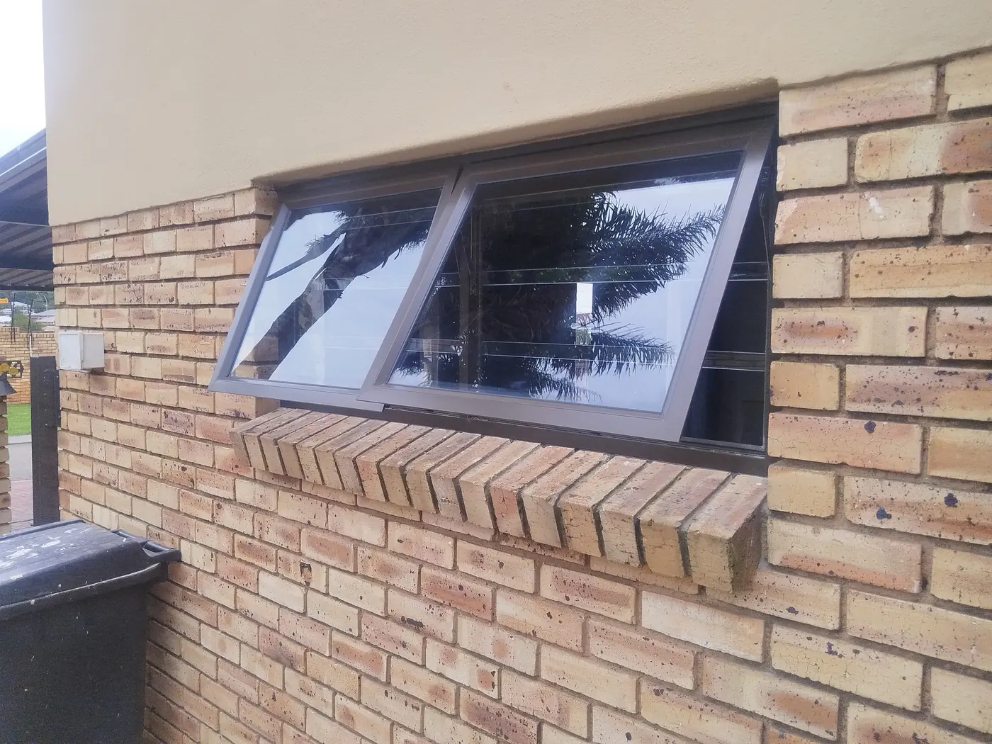 Aluminium awning window installed on a brick home for a household client